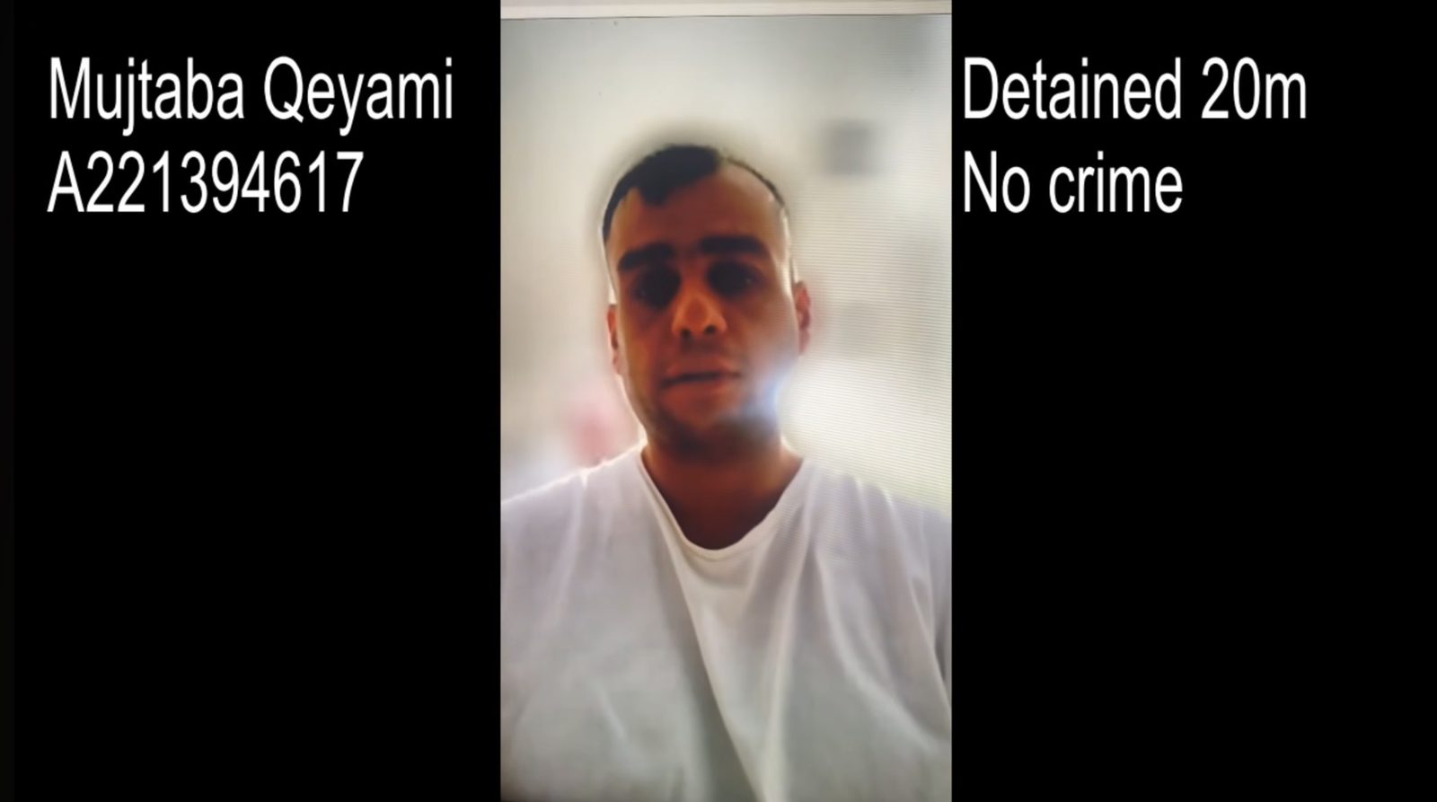 Video still of Mujtaba Qeyami, who has short dark hair. On-screen text reads: “Mujtaba Qeyami, A221394617. Detained 20m. No crime.”
